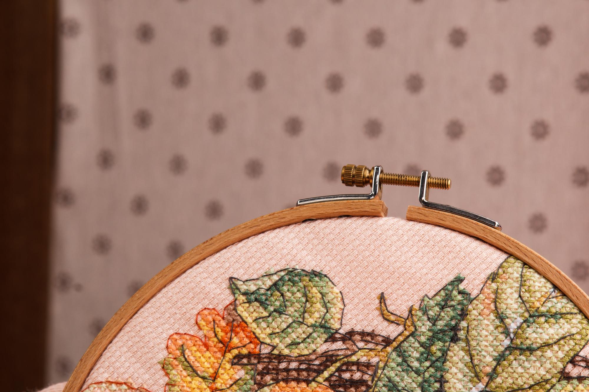Large embroidered wall panel in neutral tones
